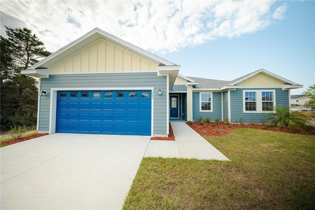 ranch-style house with a front yard, a garage, board and batten siding, and driveway