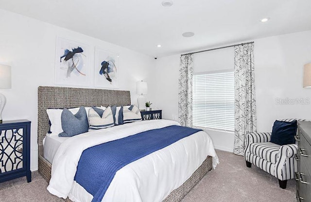 carpeted bedroom featuring recessed lighting