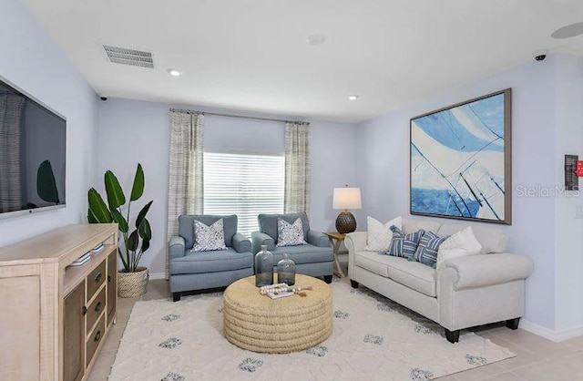 living area with recessed lighting, baseboards, and visible vents