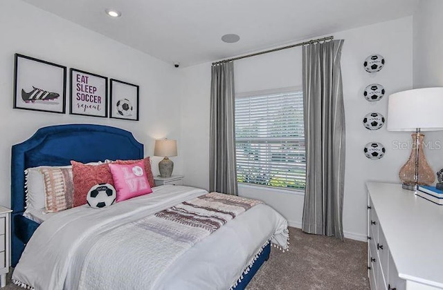 bedroom with carpet flooring and baseboards