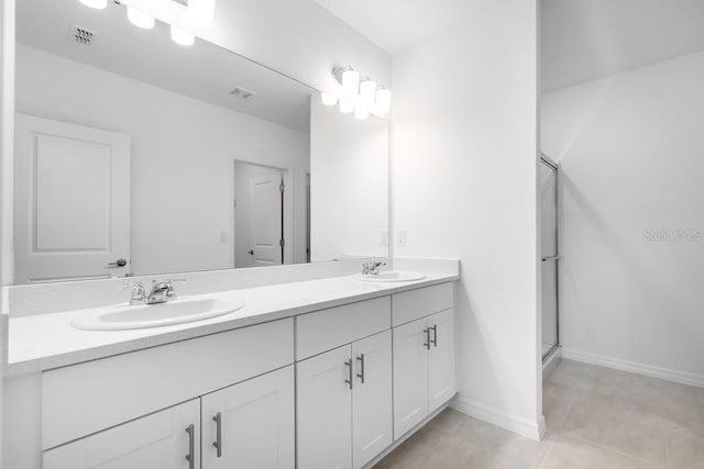 full bath with tile patterned floors, visible vents, a sink, and double vanity
