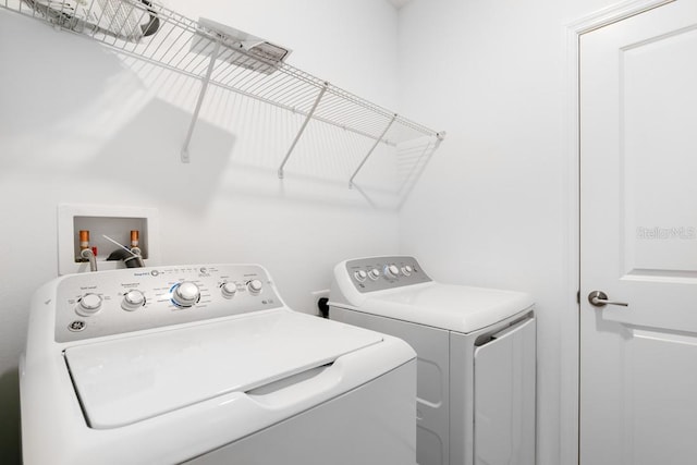 laundry room with laundry area and separate washer and dryer