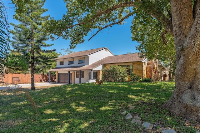 view of front of home featuring a front lawn, stone siding, fence, concrete driveway, and a garage