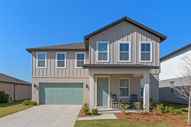 view of front of home featuring a porch, an attached garage, board and batten siding, and concrete driveway