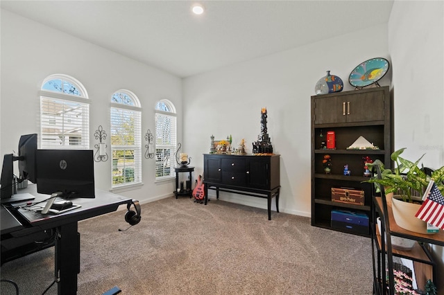 office area featuring light colored carpet and baseboards