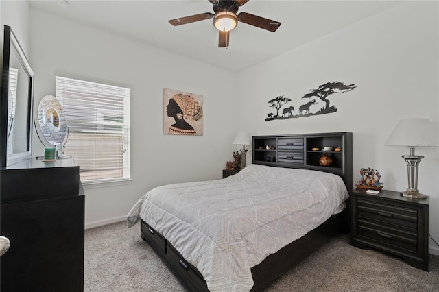 bedroom with baseboards, carpet floors, and a ceiling fan