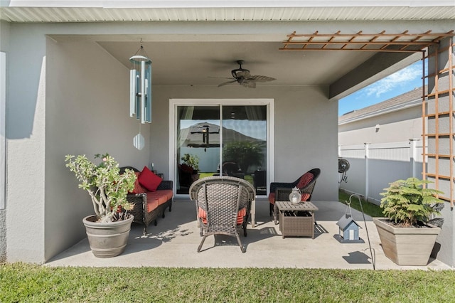 view of patio / terrace featuring a ceiling fan and fence