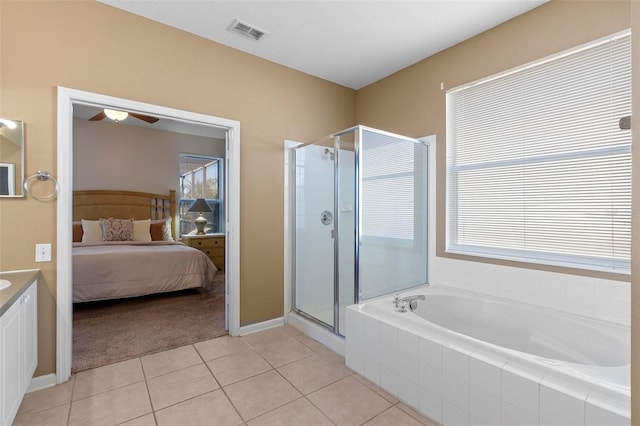 full bath with visible vents, a healthy amount of sunlight, a shower stall, and ensuite bathroom