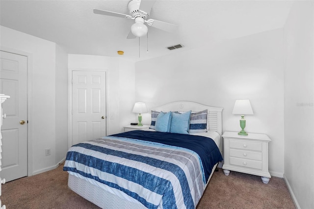 bedroom featuring visible vents, baseboards, a ceiling fan, and carpet flooring