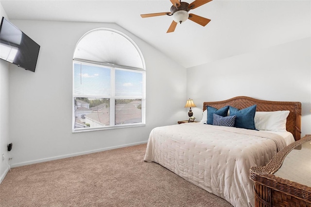 bedroom featuring baseboards, lofted ceiling, a ceiling fan, and carpet flooring