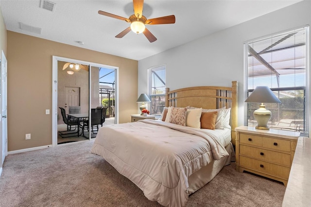 bedroom featuring visible vents, light carpet, access to exterior, baseboards, and ceiling fan