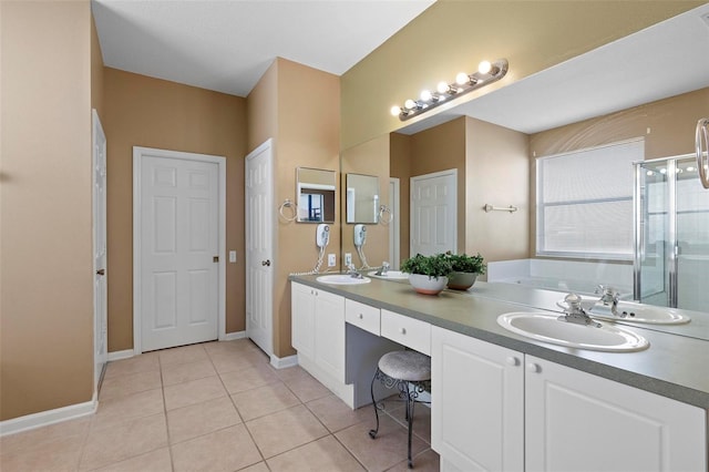 bathroom with tile patterned flooring, a shower stall, double vanity, a bath, and a sink