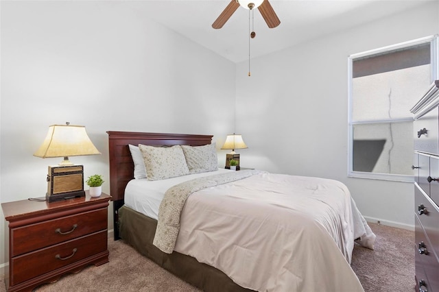 bedroom featuring a ceiling fan, baseboards, and carpet floors