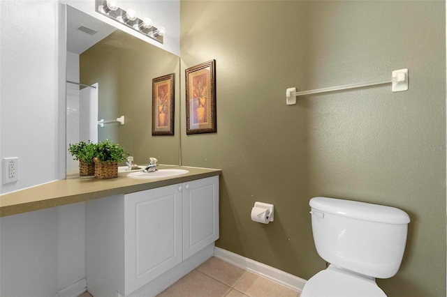 bathroom with tile patterned floors, visible vents, toilet, baseboards, and vanity