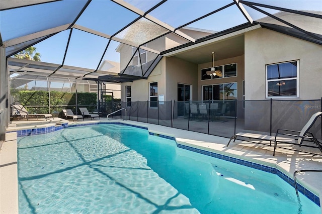 view of pool with glass enclosure, a patio, and a fenced in pool