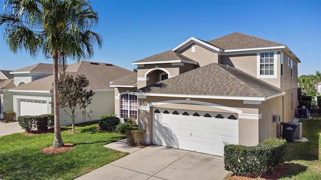 view of front of house featuring stucco siding, a garage, roof with shingles, and driveway