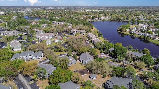 birds eye view of property with a residential view and a water view