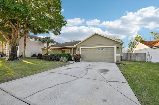 single story home with stucco siding, concrete driveway, and a front lawn