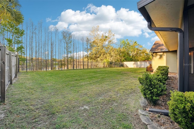 view of yard with a fenced backyard