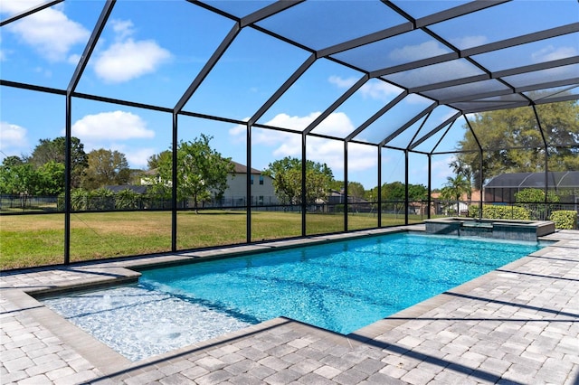 view of swimming pool with a lanai, a yard, a pool with connected hot tub, and a patio