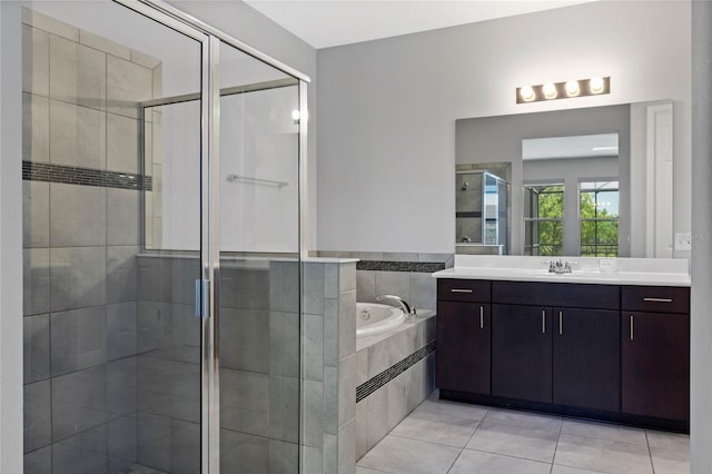 full bath with a garden tub, a stall shower, vanity, and tile patterned flooring