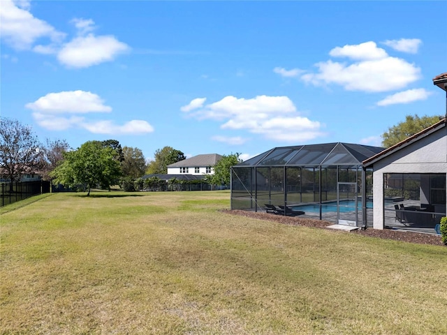 view of yard featuring an outdoor pool and a lanai