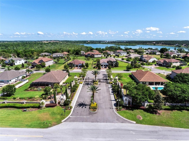 birds eye view of property with a water view and a residential view