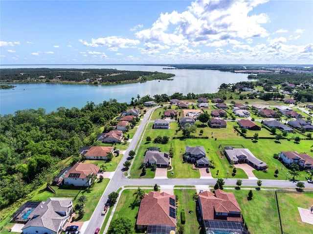 birds eye view of property with a residential view and a water view