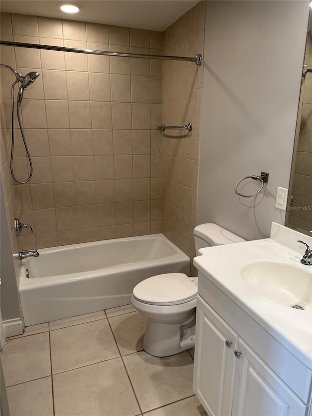 full bath featuring tile patterned floors, vanity, toilet, and bathing tub / shower combination