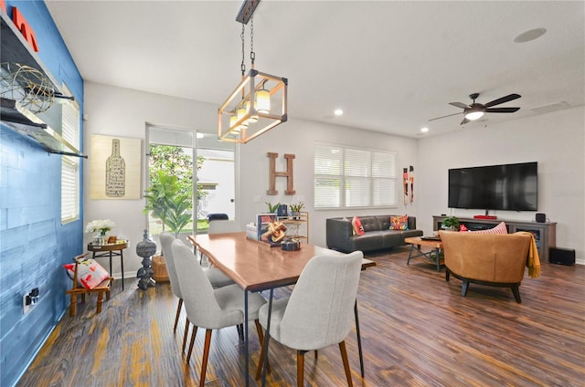 dining space with recessed lighting, plenty of natural light, and dark wood-style floors