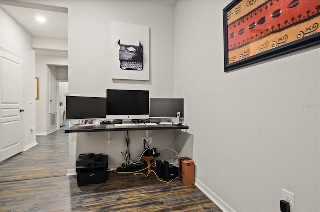 home office with baseboards and dark wood-style flooring