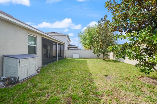 view of yard featuring a fenced backyard and a sunroom