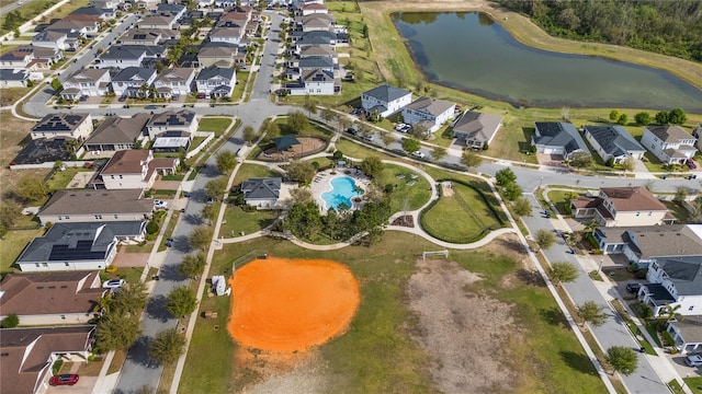 bird's eye view featuring a water view and a residential view