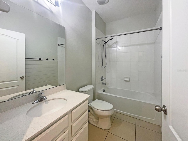 full bathroom with tile patterned flooring,  shower combination, toilet, and vanity