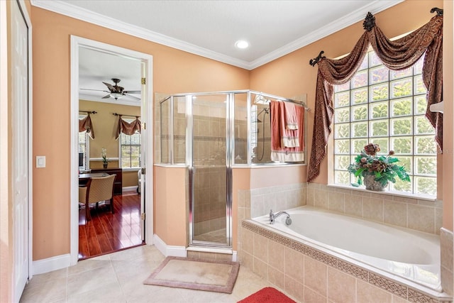 ensuite bathroom with a wealth of natural light, tile patterned flooring, a stall shower, and ornamental molding