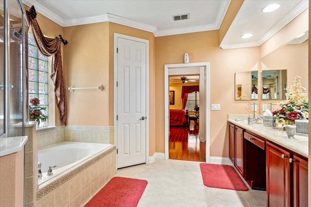 ensuite bathroom with visible vents, double vanity, crown molding, a bath, and connected bathroom