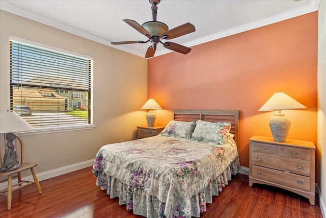 bedroom featuring crown molding, wood finished floors, baseboards, and ceiling fan