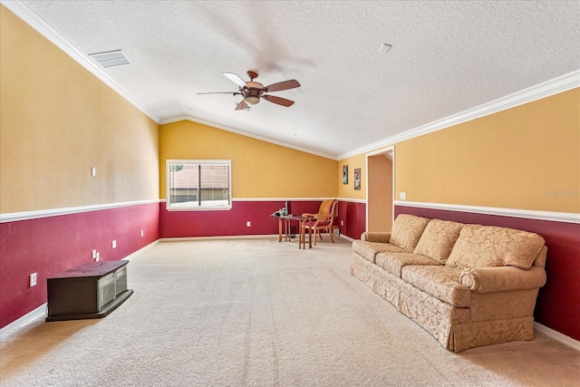 living area with a textured ceiling, lofted ceiling, and ceiling fan