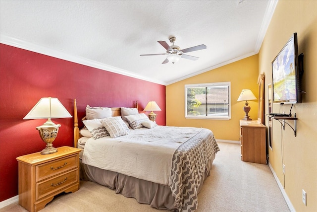 bedroom featuring light carpet, a ceiling fan, crown molding, baseboards, and vaulted ceiling