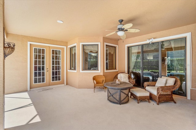 exterior space with french doors and a ceiling fan