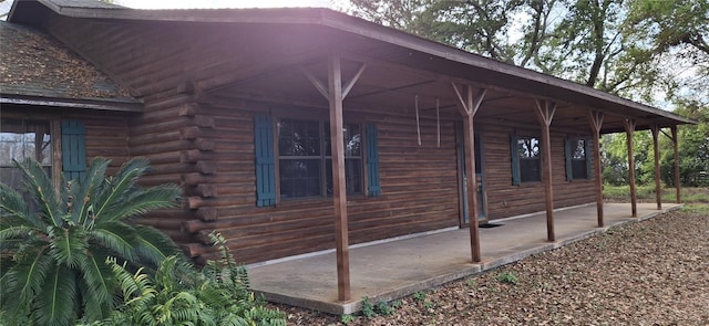 view of home's exterior with log siding