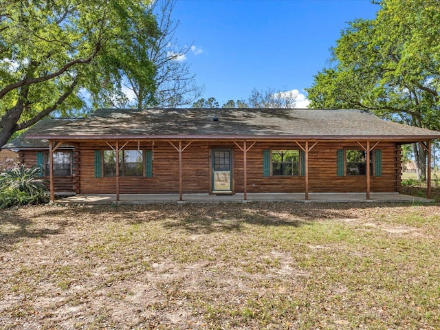 rear view of property featuring log exterior