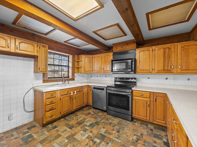 16510 Quarter Horse Ct, Montverde, FL 34756 - kitchen featuring stone finish flooring, appliances with stainless steel finishes, light countertops, and a sink