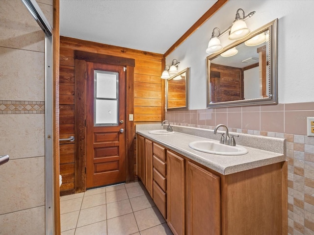 16510 Quarter Horse Ct, Montverde, FL 34756 - bathroom with a sink, tile walls, tile patterned floors, and double vanity