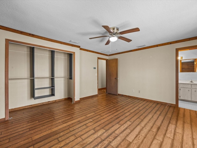 16510 Quarter Horse Ct, Montverde, FL 34756 - unfurnished bedroom featuring visible vents, a textured ceiling, a closet, and wood finished floors