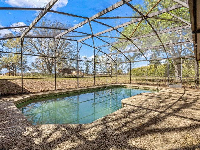 16510 Quarter Horse Ct, Montverde, FL 34756 - outdoor pool with glass enclosure and a patio area