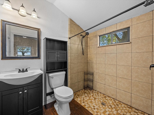 16510 Quarter Horse Ct, Montverde, FL 34756 - bathroom featuring tiled shower, a textured ceiling, wood finished floors, and toilet