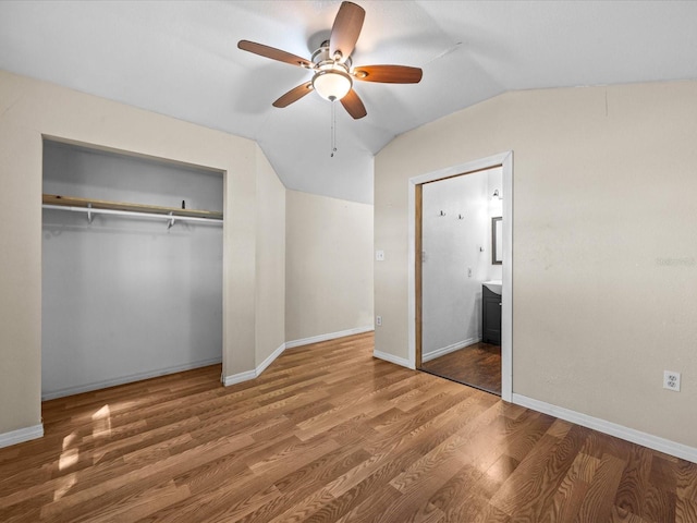 16510 Quarter Horse Ct, Montverde, FL 34756 - unfurnished bedroom featuring baseboards, lofted ceiling, wood finished floors, a closet, and a ceiling fan