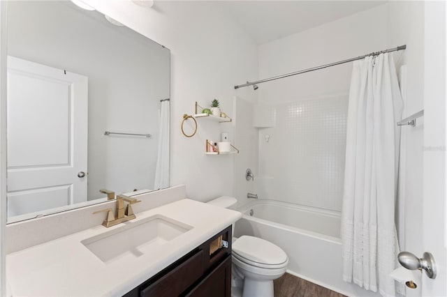 full bathroom featuring vanity, toilet, shower / tub combo, and wood finished floors