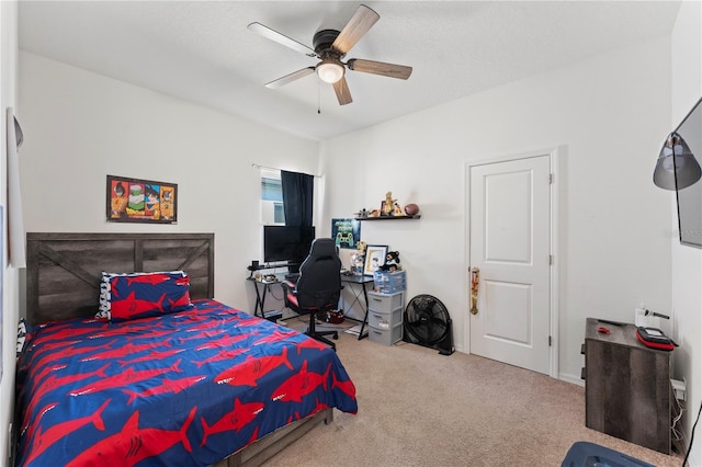 carpeted bedroom featuring a ceiling fan